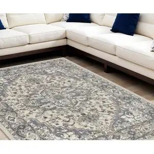 Photo of Blue and Ivory Medallion Power Loom Distressed Area Rug