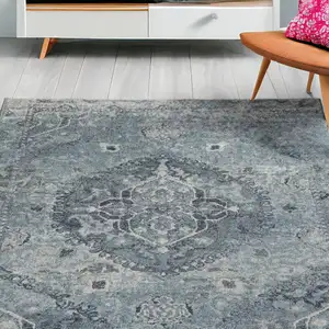 Photo of Blue and Ivory Oriental Distressed Area Rug