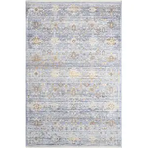 Photo of Blue and Ivory Oriental Power Loom Distressed Area Rug With Fringe