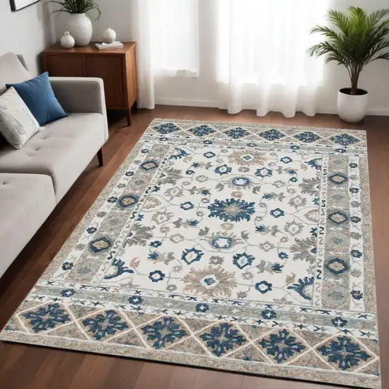 Blue and Ivory Wool Floral Hand Tufted Area Rug Photo 1