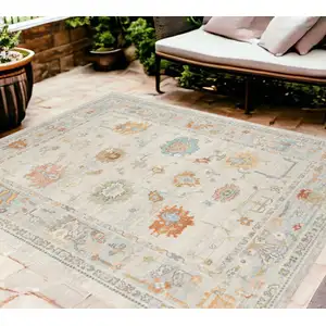 Photo of Blue and Orange Floral Stain Resistant Indoor Outdoor Area Rug