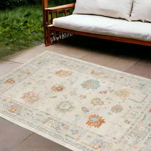 Photo of Blue and Orange Floral Stain Resistant Indoor Outdoor Area Rug