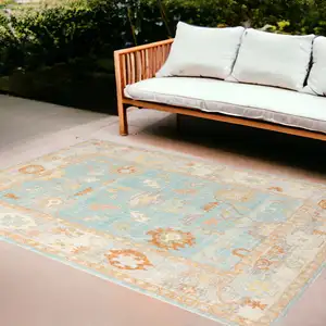 Photo of Blue and Orange Floral Stain Resistant Indoor Outdoor Area Rug