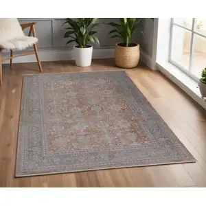 Photo of Blue and Red Oriental Power Loom Worn Faded Area Rug With Fringe