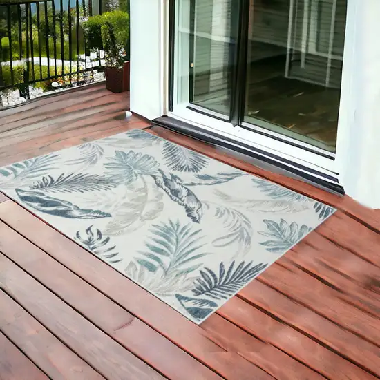 Blue and Serene White Palm Leaf Stain Resistant Indoor Outdoor Area Rug Photo 1