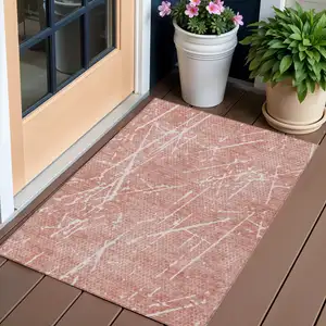 Photo of Blush And Ivory Abstract Washable Indoor Outdoor Area Rug