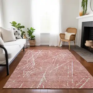 Photo of Blush And Ivory Abstract Washable Indoor Outdoor Area Rug