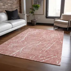 Photo of Blush And Ivory Abstract Washable Indoor Outdoor Area Rug