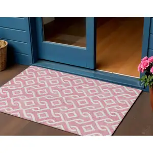 Photo of Blush And Ivory Geometric Washable Indoor Outdoor Area Rug