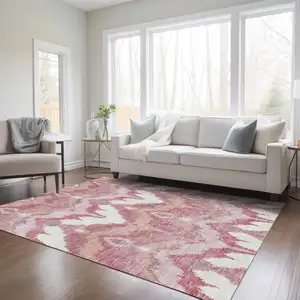 Photo of Blush Mauve And Ivory Ikat Washable Indoor Outdoor Area Rug