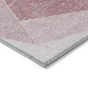 Photo of Blush Pink And Ivory Geometric Washable Indoor Outdoor Area Rug