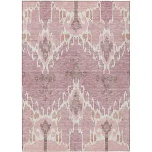 Photo of Blush Pink And Ivory Ikat Washable Indoor Outdoor Area Rug