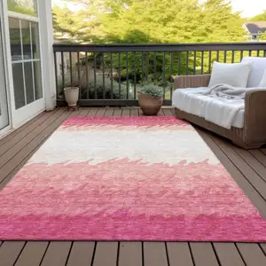 Photo of Blush Pink And Ivory Striped Washable Indoor Outdoor Area Rug