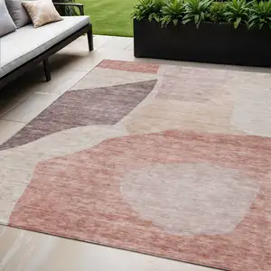 Photo of Blush Pink And Mauve Abstract Washable Indoor Outdoor Area Rug