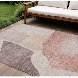 Photo of Blush Pink And Mauve Abstract Washable Indoor Outdoor Area Rug