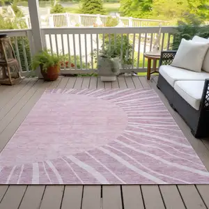 Photo of Blush Pink And Mauve Abstract Washable Indoor Outdoor Area Rug