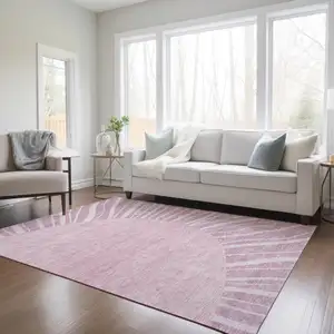 Photo of Blush Pink And Mauve Abstract Washable Indoor Outdoor Area Rug