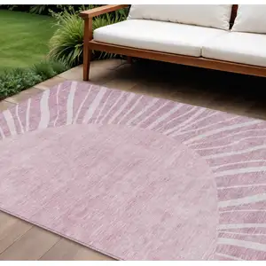 Photo of Blush Pink And Mauve Abstract Washable Indoor Outdoor Area Rug