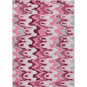 Photo of Blush Pink And Mauve Abstract Washable Indoor Outdoor Area Rug