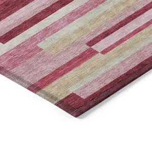 Photo of Blush Pink And Mauve Striped Washable Indoor Outdoor Area Rug