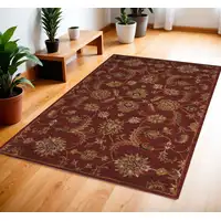 Photo of Brick Red and Orange Wool Floral Area Rug