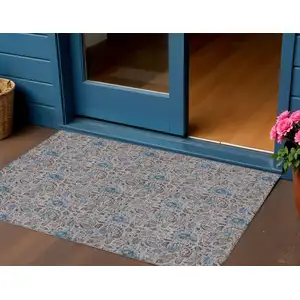 Photo of Brown And Blue Floral Washable Indoor Outdoor Area Rug