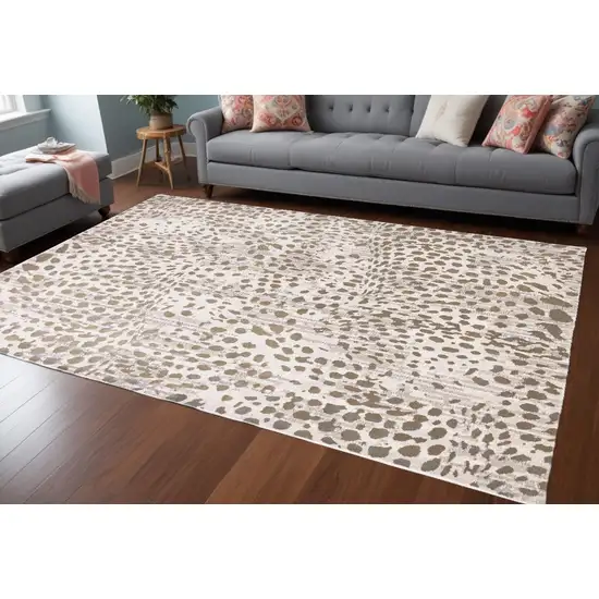 Brown And Ivory Abstract Stain Resistant Area Rug Photo 1