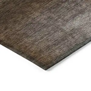 Photo of Brown And Ivory Abstract Washable Indoor Outdoor Area Rug