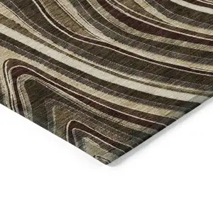 Photo of Brown And Ivory Abstract Washable Indoor Outdoor Area Rug