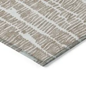 Photo of Brown And Ivory Abstract Washable Indoor Outdoor Area Rug