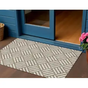 Photo of Brown And Ivory Geometric Washable Indoor Outdoor Area Rug