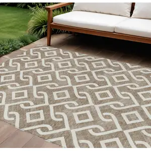 Photo of Brown And Ivory Geometric Washable Indoor Outdoor Area Rug