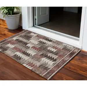 Photo of Brown And Ivory Southwestern Washable Indoor Outdoor Area Rug