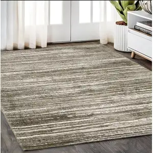 Photo of Brown And Ivory Striped Distressed Area Rug