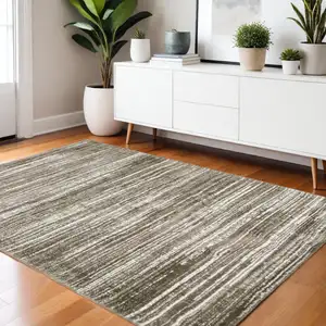 Photo of Brown And Ivory Striped Distressed Area Rug