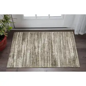 Photo of Brown And Ivory Striped Distressed Area Rug