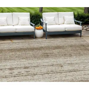 Photo of Brown And Ivory Striped Washable Indoor Outdoor Area Rug