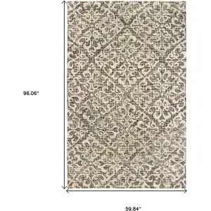 Photo of Brown And Ivory Wool Floral Hand Tufted Area Rug