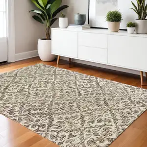 Photo of Brown And Ivory Wool Floral Hand Tufted Area Rug