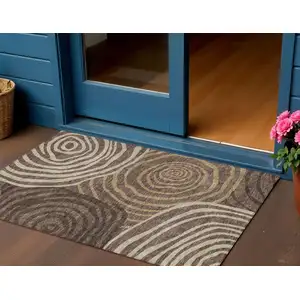 Photo of Brown And Taupe Abstract Washable Indoor Outdoor Area Rug