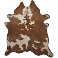 Photo of Brown And White Cowhide - Area Rug