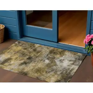 Photo of Brown Beige And Gold Abstract Washable Indoor Outdoor Area Rug