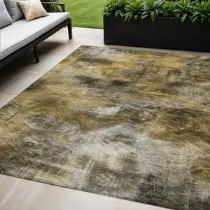 Photo of Brown Beige And Gold Abstract Washable Indoor Outdoor Area Rug