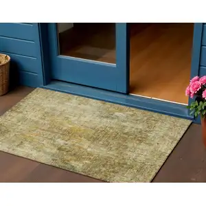 Photo of Brown Beige And Gold Abstract Washable Indoor Outdoor Area Rug