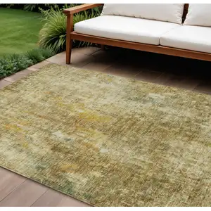 Photo of Brown Beige And Gold Abstract Washable Indoor Outdoor Area Rug