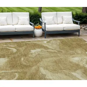 Photo of Brown Beige And Ivory Abstract Washable Indoor Outdoor Area Rug