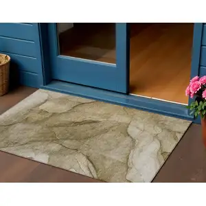 Photo of Brown Beige And Taupe Abstract Washable Indoor Outdoor Area Rug