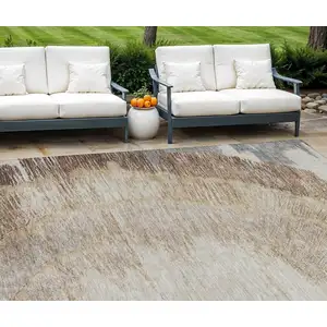 Photo of Brown Beige And Taupe Abstract Washable Indoor Outdoor Area Rug