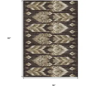 Photo of Brown Beige And Taupe Southwestern Washable Indoor Outdoor Area Rug