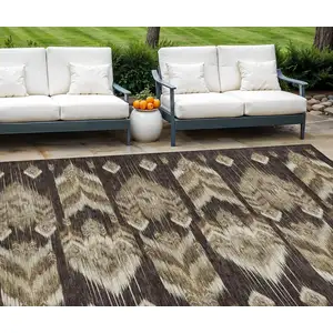 Photo of Brown Beige And Taupe Southwestern Washable Indoor Outdoor Area Rug